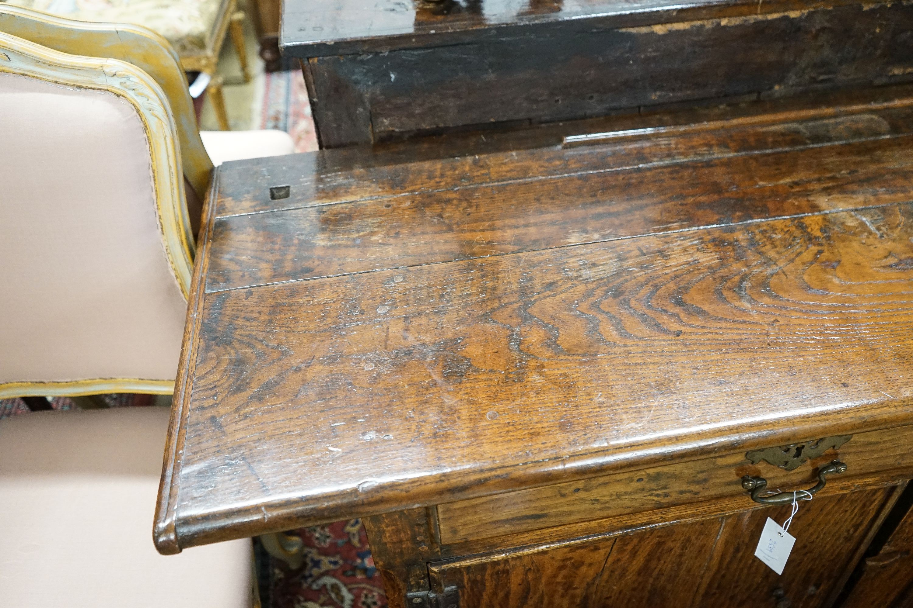 An 18th century and later oak low dresser, length 182cm, depth 52cm, height 75cm